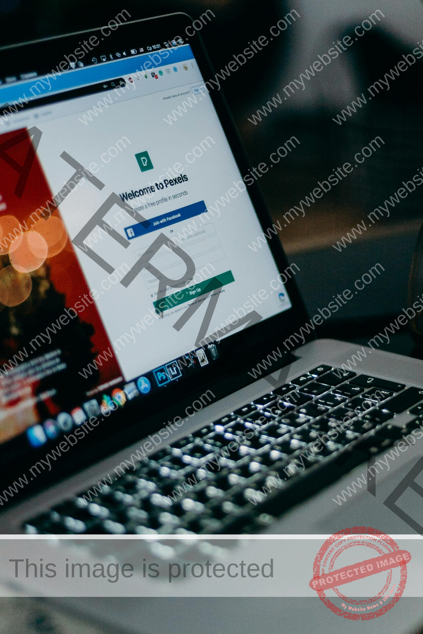 Close-up of a laptop showing the Pexels login interface with a blurred background, creating a moody tech scene.