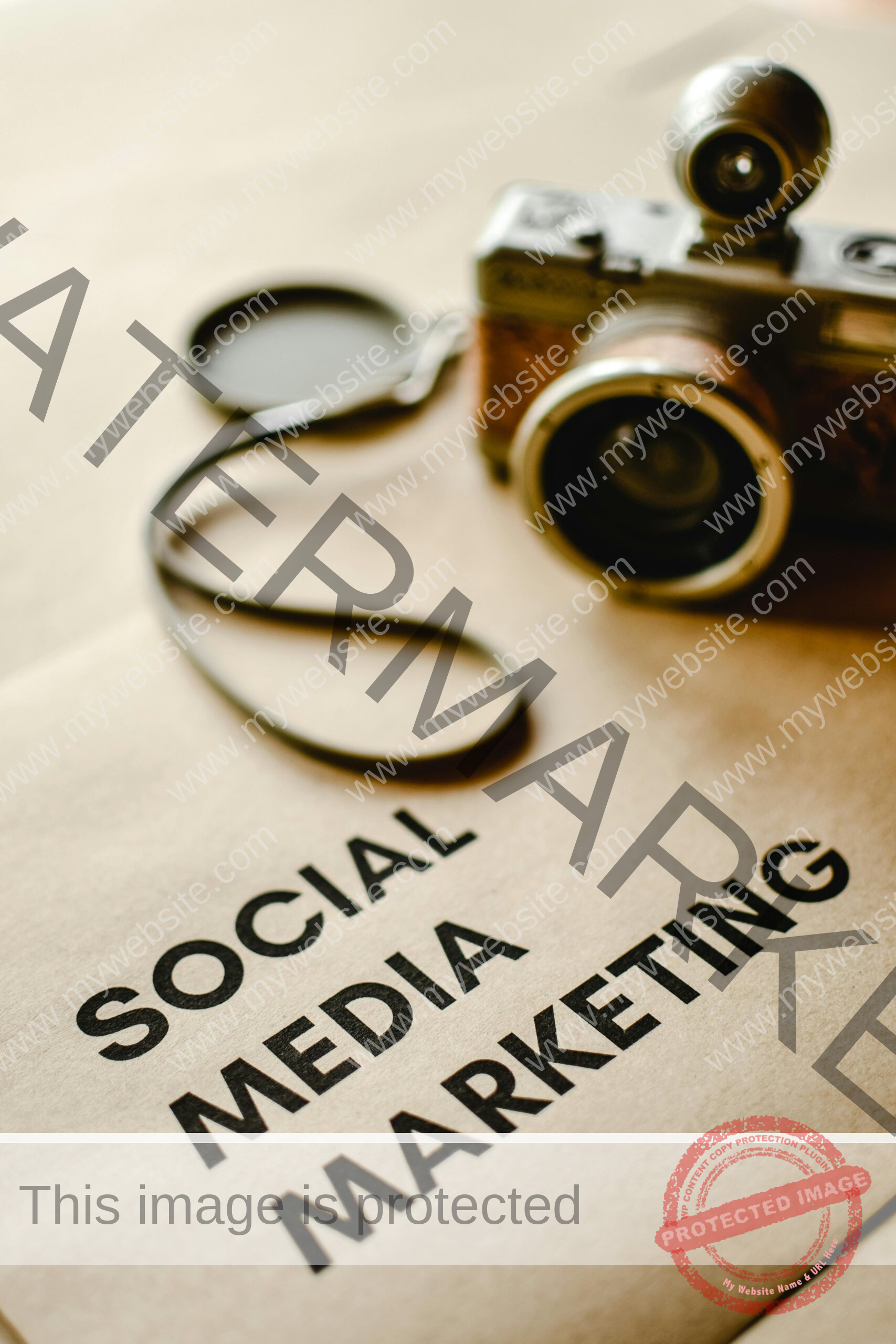 Close-up of a vintage camera on brown paper labeled with 'Social Media Marketing'.