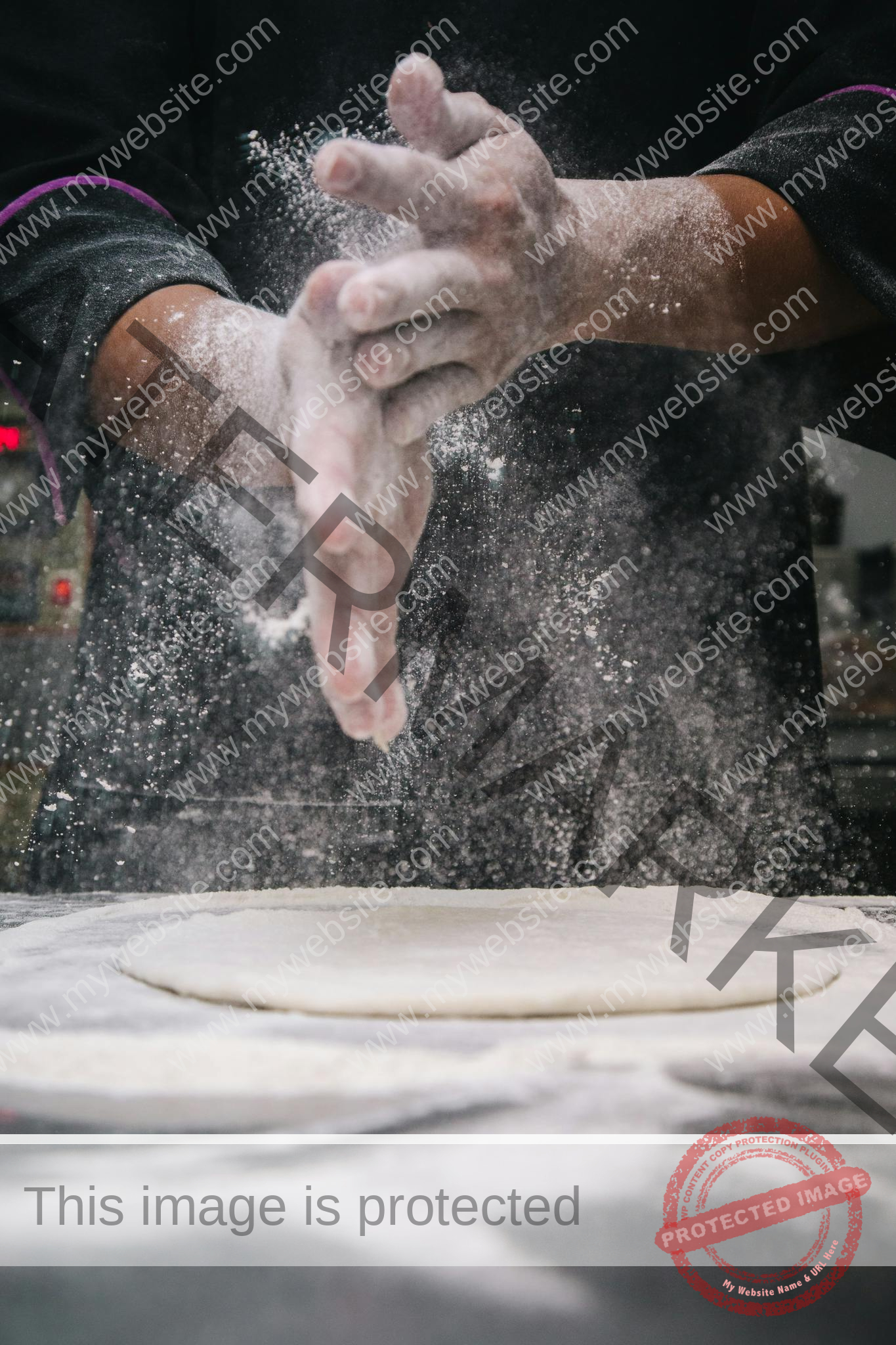 A chef clapping hands over dough, releasing flour in a kitchen setting.